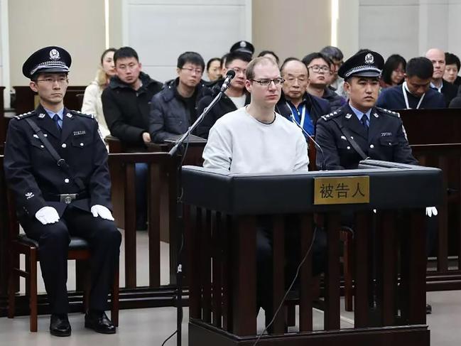 This photograph taken and released by the Intermediate Peoples' Court of Dalian on January 14, 2019 shows Canadian Robert Lloyd Schellenberg (C) during his retrial on drug trafficking charges in the court in Dalian in China's northeast Liaoning province. - The court sentenced Schellenberg to death on drug trafficking charges on January 14, 2019 after his previous 15-year prison sentence was deemed too lenient, a ruling that has deepened a diplomatic rift between Ottawa and Beijing. (Photo by HANDOUT / HO / AFP) / -----EDITORS NOTE --- RESTRICTED TO EDITORIAL USE - MANDATORY CREDIT "AFP PHOTO / Intermediate Peoples' Court of Dalian" - NO MARKETING - NO ADVERTISING CAMPAIGNS - DISTRIBUTED AS A SERVICE TO CLIENTS - NO ARCHIVES