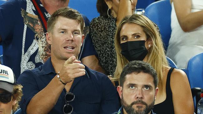 David Warner and Candice Warner watch the Men's Singles Final match.