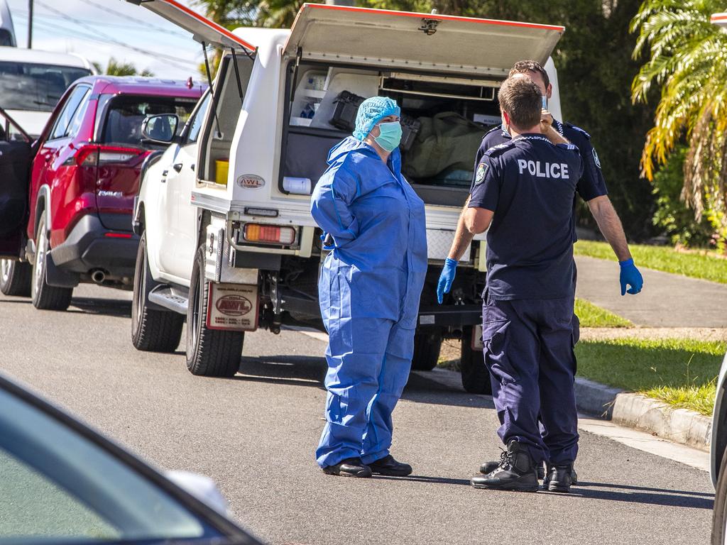 Investigators on scene of the fatal house fire in Collingwood Park. Picture: Richard Walker