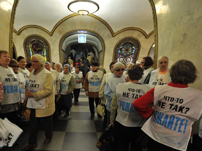 Members of pro-Kremlin group Starsheye Pokoleniye (Older Generation) rallying for higher birthrates in Russia, wearing vests with the slogan ‘Is anything wrong? Give birth!’