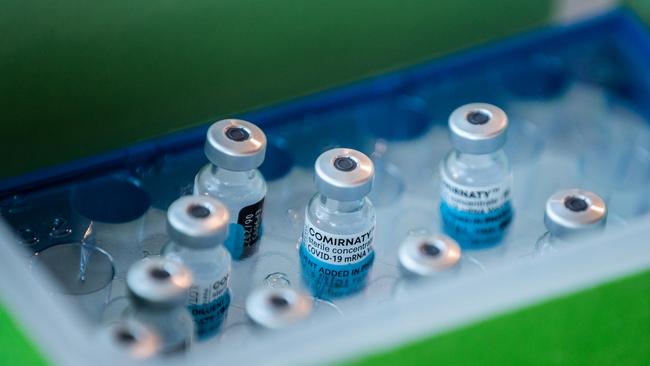 Pfizer-BioNTech COVID-19 vaccine vials sit in a storage container in Melbourn. Picture: Asanka Ratnayake/Getty Images