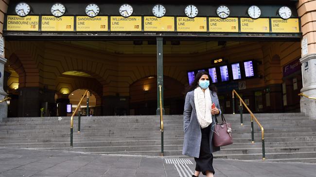 Melburnians must wear masks when out and about. Picture: William West/AFP.