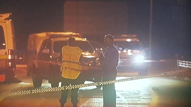 Police at the scene on the Pacific Highway after the shooting. Picture: Frank Redwood