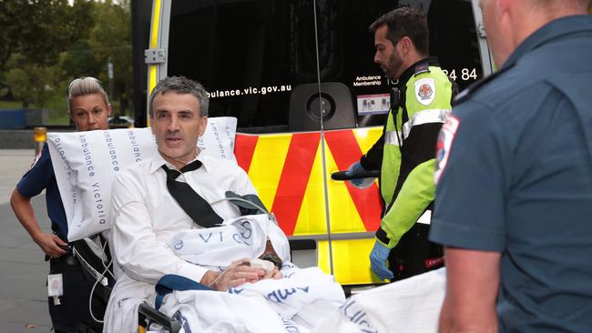 He collapsed on the stand and was taken away by ambulance. Picture: Stefan Postles/AAP