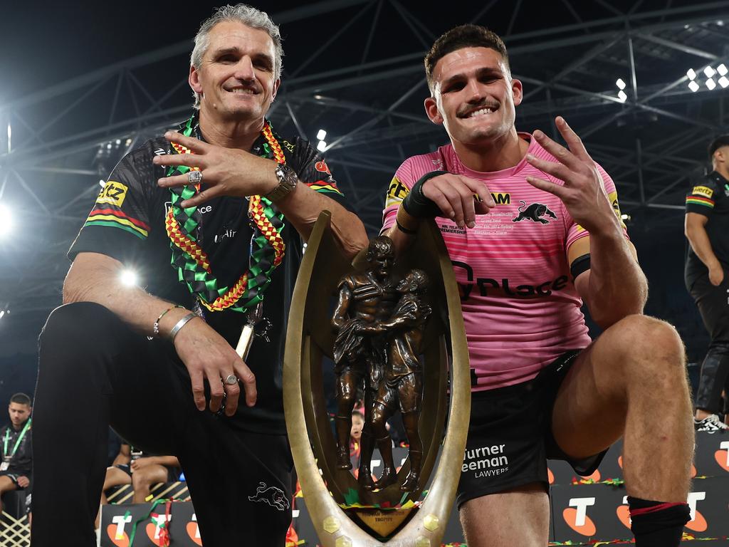 SYDNEY, AUSTRALIA – OCTOBER 06: Nathan Cleary (R) of the Panthers poses with the Provan-Summons Trophy alongside his father and coach Ivan Cleary after winning the 2024 NRL Grand Final match between the Melbourne Storm and the Penrith Panthers at Accor Stadium on October 06, 2024, in Sydney, Australia. (Photo by Cameron Spencer/Getty Images)