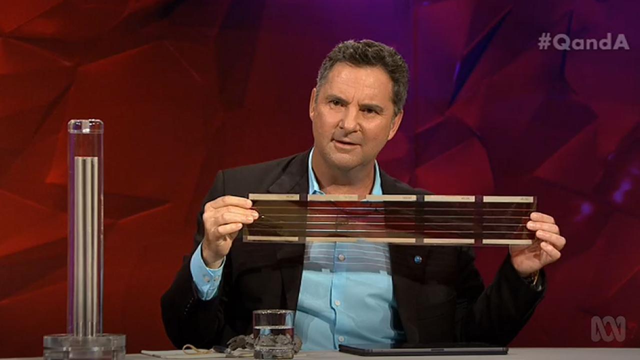 CSIRO chief executive Dr Larry Marshall holds 3D printed solar cells, while a model “hydrogen cracker” sits on the bench beside him. Source: ABC.