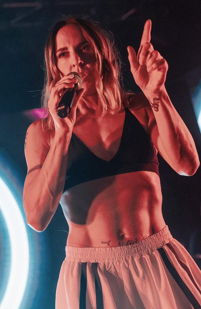 Spice Girl Mel C shows off her incredible ripped abs as she performs in a  sports bra