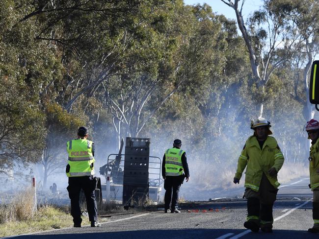 A woman has died after the car she was travelling in collided with a truck carrying fuel.