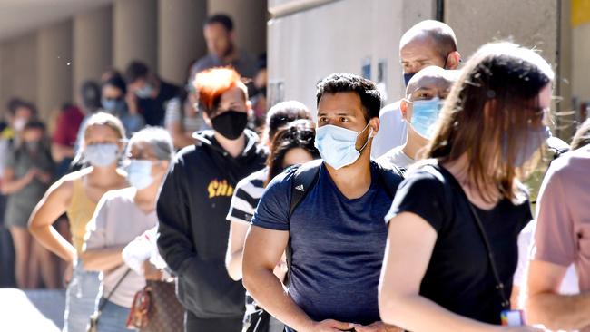 BRISBANE, AUSTRALIA - NewsWire Photos September 20, 2021: Lines of people at the Brisbane vaccination hub at Brisbane Convention and Exhibition Centre after a record-breaking weekend leads Queensland several steps closer to opening its borders. Picture: NCA NewsWire / John Gass