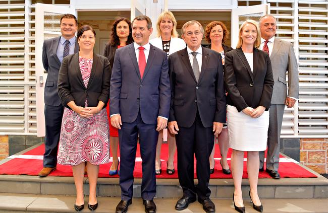 One big happy family: The Labor Government cabinet being sworn in in September 2016. Front row: Natasha Fyles, Chief Minister Michael Gunner, Administrator of the Northern Territory John Hardy, Deputy Chief Minister Nicole Manison. Back row: Ken Vowles, Lauren Moss, Eva Lawler, Dale Wakefield, and Gerry McCarthy