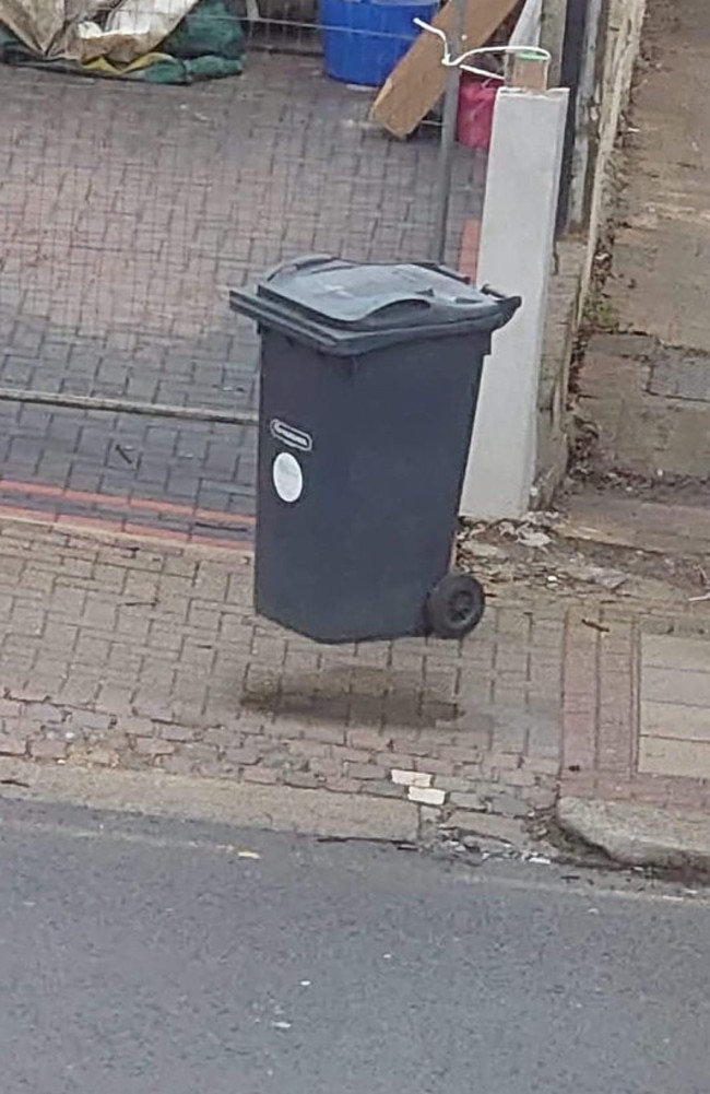 This photo of a bin appearing to float in mid-air has captured the attention of everyone in isolation. Picture: Reddit