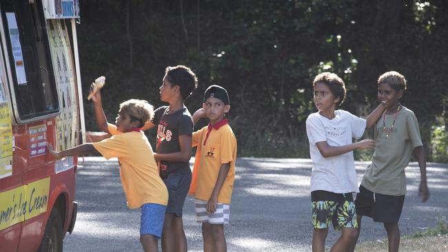 Children line up for their free vaccination ice cream in Yarrabah. Picture: Brian Cassey