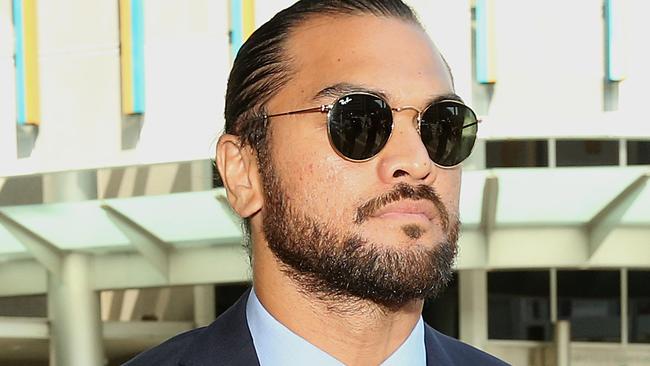 Karmichael Hunt leaves the Magistrates Court in Brisbane on Monday after escaping a conviction for cocaine possession.