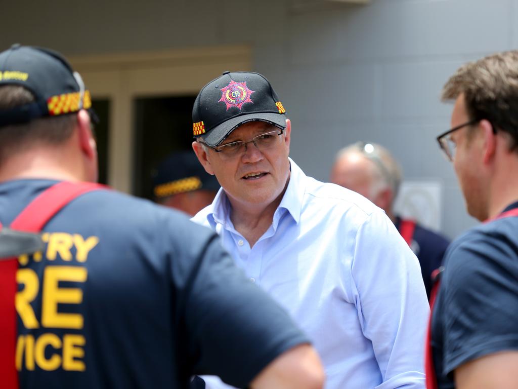 Prime Minister Scott Morrison was under pressure to give more to exhausted fireys. Picture: AAP Image/Kelly Barnes