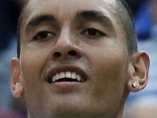 Nick Kyrgios of Australia celebrates defeating Rafael Nadal of Spain in their men's singles match on Centre Court at the All England Lawn Tennis Championships in Wimbledon, London, Tuesday, July 1, 2014. (AP Photo/Ben Curtis)