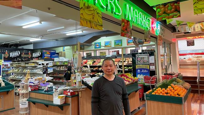 Alex Chen at his Farmers Market grocery store.