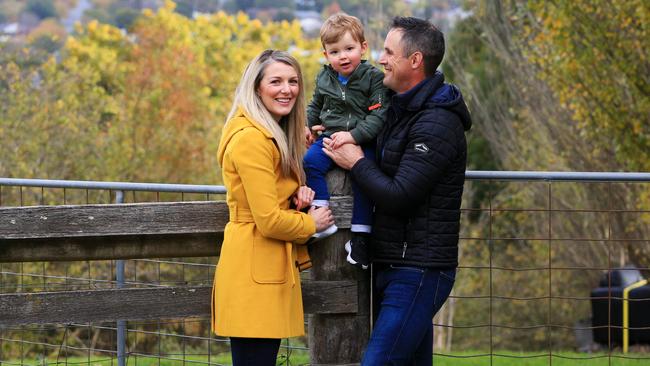 Lauren Andrews and husband Wade with their son Casey, 2, at their home in Gisborne, Victoria. Picture: Aaron Francis