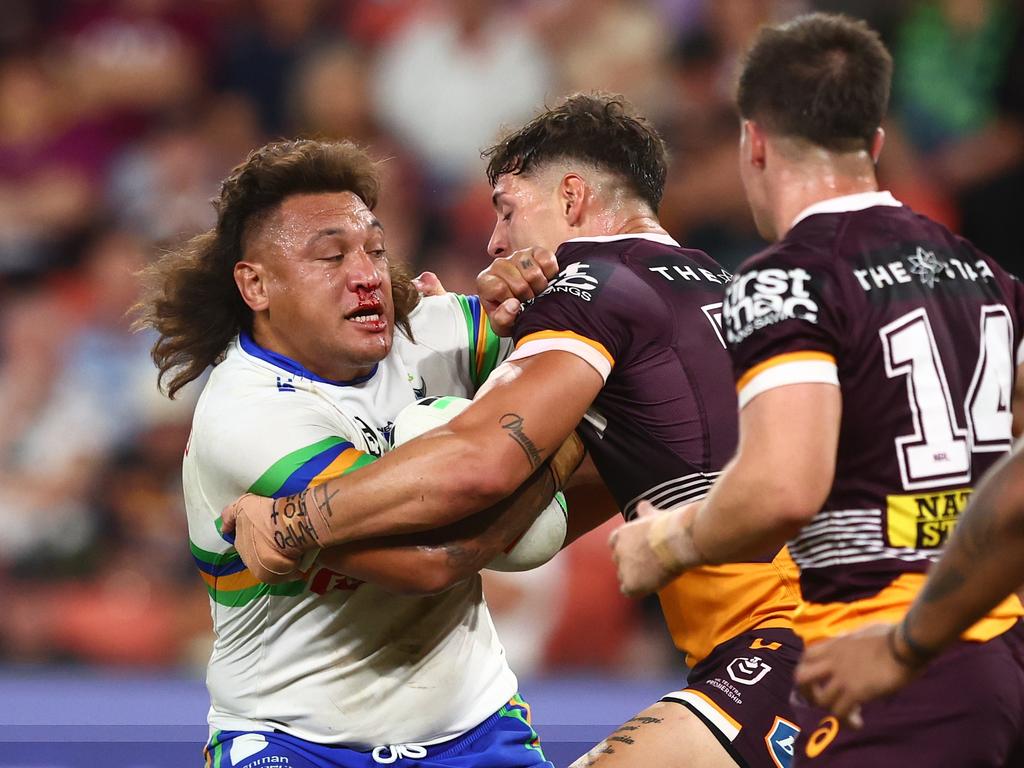 Josh Papali'i taking a hit up against the Broncos in 2023. Picture: Chris Hyde/Getty