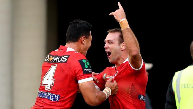 Dragons winger Jason Nightingale celebrates scoring his third try against Wests Tigers. Picture: Gregg Porteous