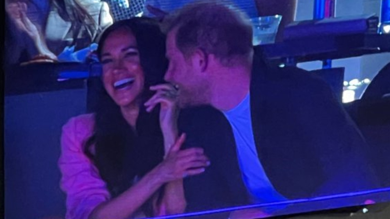 Prince Harry and Meghan Markle were caught on the kiss cam at a Lakers game.