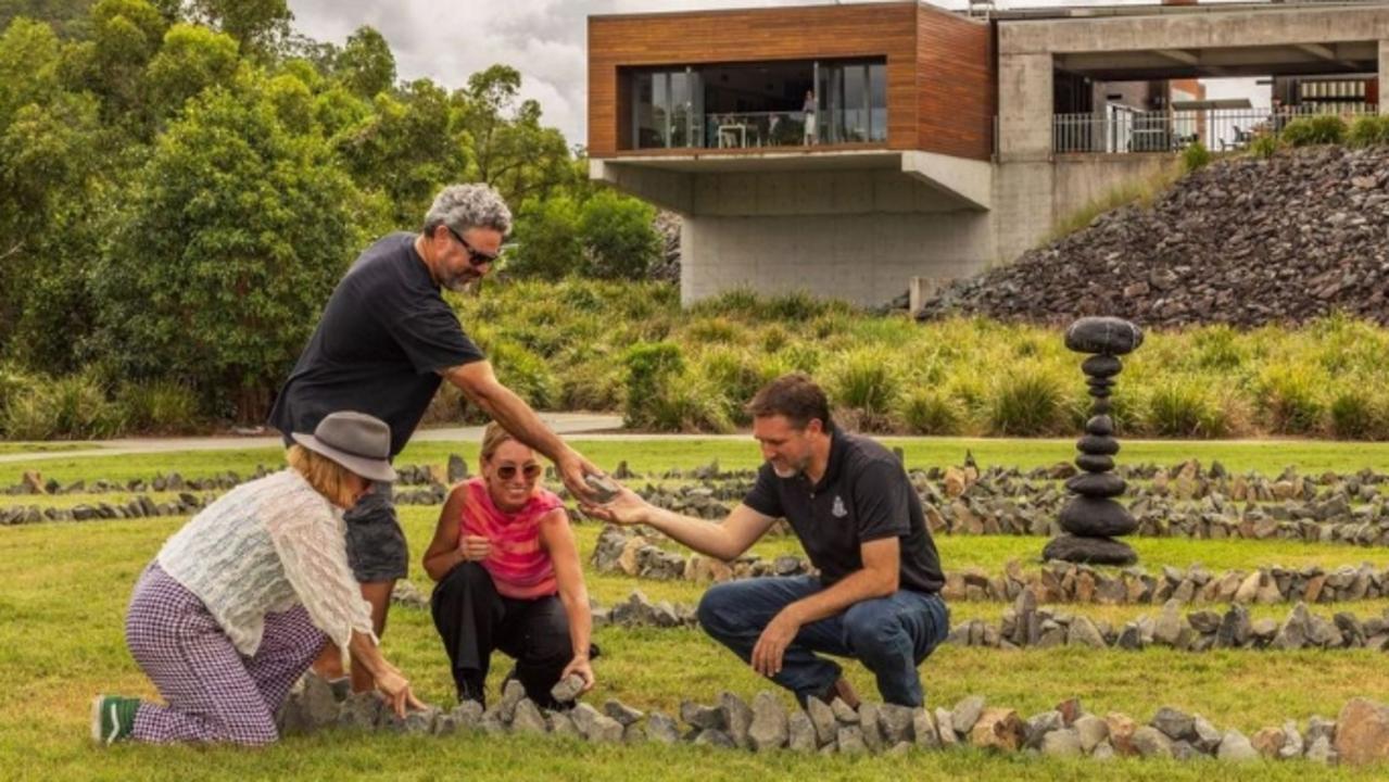 Hinterland-based councillor Glenn Tozer (far right) checking the SWELL Sculpture festival Waterlines art works.