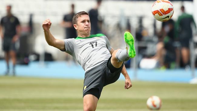 MELBOURNE, AUSTRALIA - JANUARY 05: Matt McKay of Australia kicks the ball during an Australian Socceroos training session at Lakeside Stadium on January 5, 2015 in Melbourne, Australia. (Photo by Robert Cianflone/Getty Images)