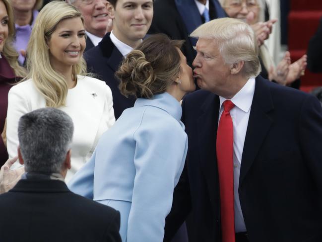 President Donald Trump kisses his wife Melania Trump before the 58th Presidential Inauguration at the U.S. Capitol in Washington on January 20, 2017. Picture: AP
