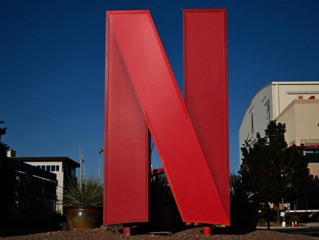 (FILES) The Netflix logo is displayed at the entrance to Netflix Albuquerque Studios film and television production studio lot in Albuquerque, New Mexico, on October 13, 2023. Netflix on October 18, 2023 said subscriber numbers grew nearly 11 percent to 247 million in the recently ended third quarter as it cracked down on password sharing and refined an ad-supported tier. The leading streaming service said it is increasing the price of its basic plan in the United States to $11.99 monthly and its premium plan to $22.99, with similar price "adjustments" set for Britain and France. (Photo by Patrick T. Fallon / AFP)