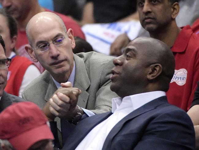 Magic Johnson (right) with NBA commissioner Adam Silver, who handed Donald Sterling his life ban.