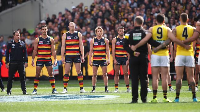 Adelaide players, led by captain Taylor Walker and coach Don Pyke stare down Richmond players before the Grand Final. But were they really a united group? Picture: Phil Hillyard