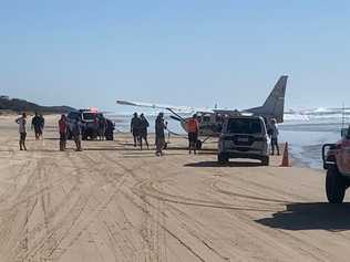 A plane had to be winched from the water after becoming bogged on Fraser Island. Picture: Contributed