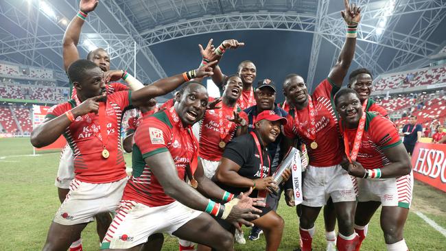 Kenya celebrate with the trophy after winning the 2016 Singapore Sevens cup final.