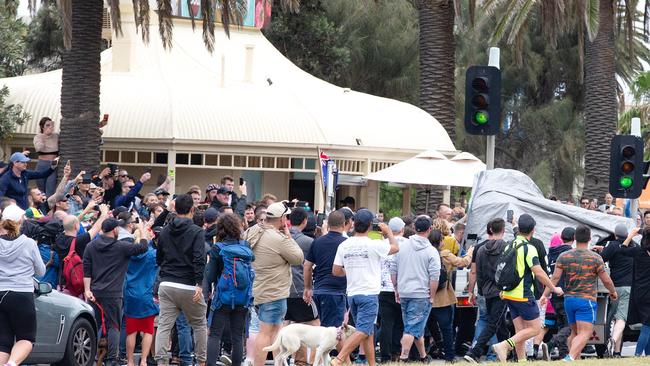 A ute passing by with an anti-racist chant playing is suddenly surrounded by opposing far-right protesters on Beaconsfield Parade. Picture: Sarah Matray