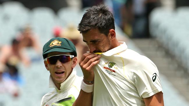 Mitchell Starc of Australia (right) with teammate Tim Paine on day two of the Boxing Day Test match between Australia and India at the MCG in Melbourne, Thursday, December 27, 2018. (AAP Image/Hamish Blair) NO ARCHIVING, EDITORIAL USE ONLY, IMAGES TO BE USED FOR NEWS REPORTING PURPOSES ONLY, NO COMMERCIAL USE WHATSOEVER, NO USE IN BOOKS WITHOUT PRIOR WRITTEN CONSENT FROM AAP