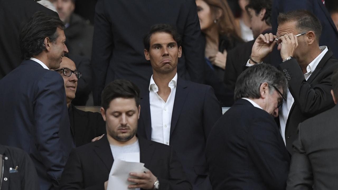Spanish tennis player Rafael Nadal looks on from the stands before the UEFA Europa League semi-final second leg football match between Club Atletico de Madrid and Arsenal FC