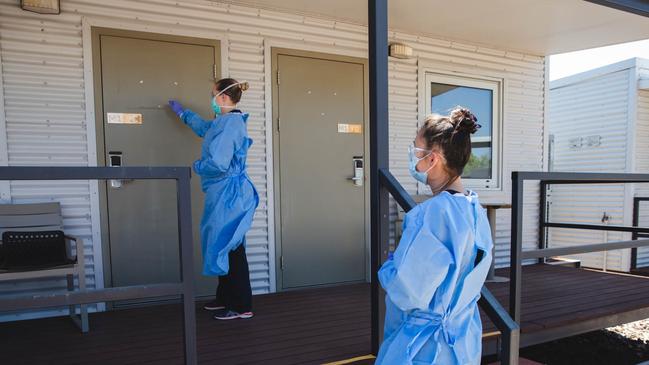 An NT Health worker checking in on a Howard Springs Quarantine Facility resident. Picture: Supplied/ NT Health