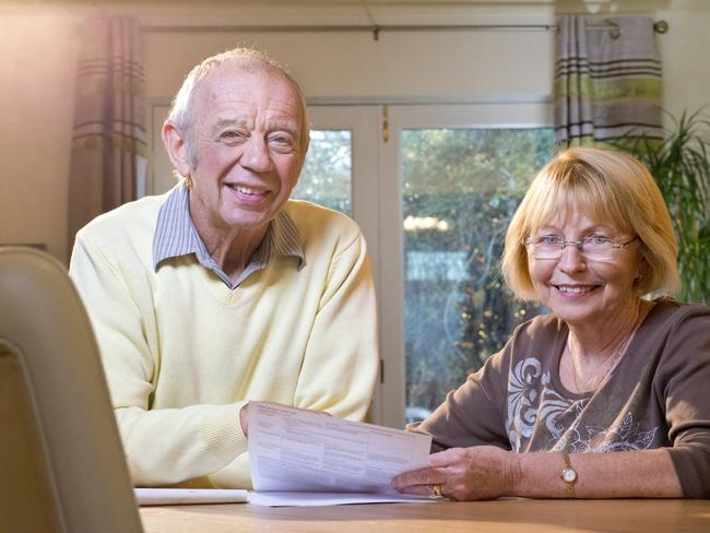 senior couple looking over paperwork; superannuation generic happy