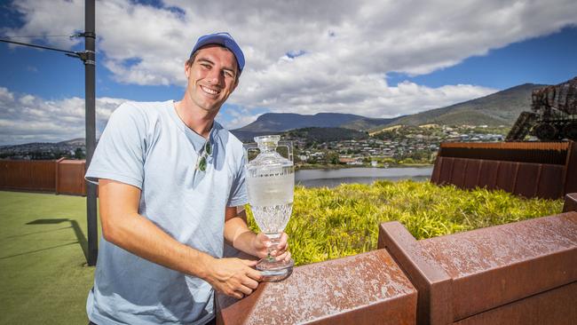 Victorious Test captain Pat Cummins with the Ashes trophy in Hobart on Monday after Australia wrapped up the series 4-0 on Sunday. Picture: Richard Jupe