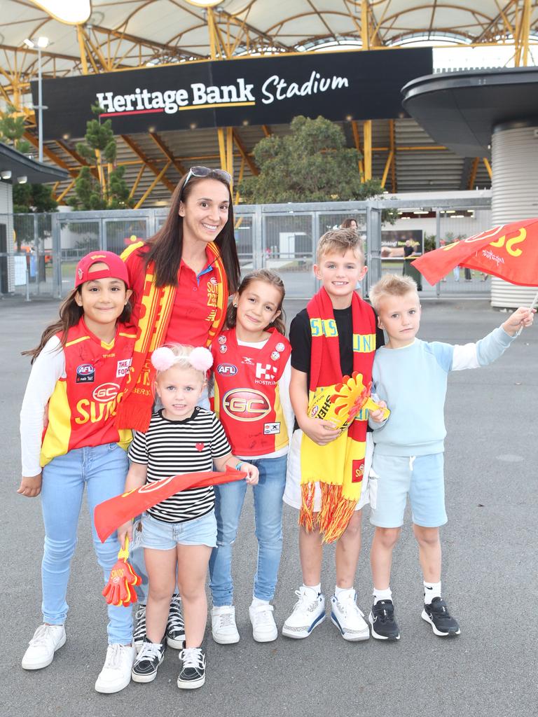 The Gold Coast Suns will host its first AFLW final when they take on the Sydney Swans on Saturday night. Grace Mackie, Mia Harris, Teagan Mackie, Lola Mackie, Ethan Harris and Oscar Harris. 11 November 2023 Carrara Picture by Richard Gosling