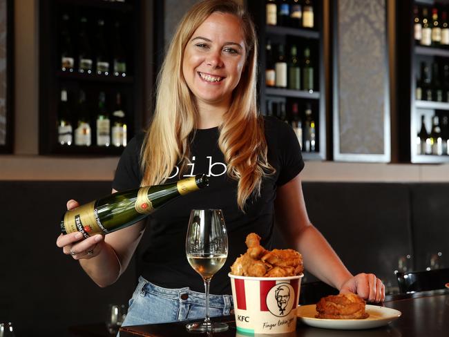 Bibo Wine Bar Double Bay sommelier Louella Mathews enjoys a 2007 Trimbach ‘Cuvée Frédéric Emile’ Riesling with KFC. Picture: Tim Hunter.