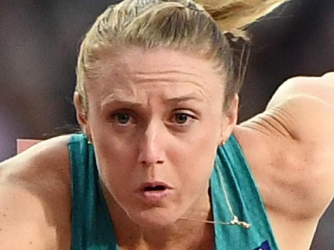 Australia's Sally Pearson jumps a hurdle on her way to winning the final of the women's 100m hurdles athletics event at the 2017 IAAF World Championships at the London Stadium in London on August 12, 2017. / AFP PHOTO / Jewel SAMAD