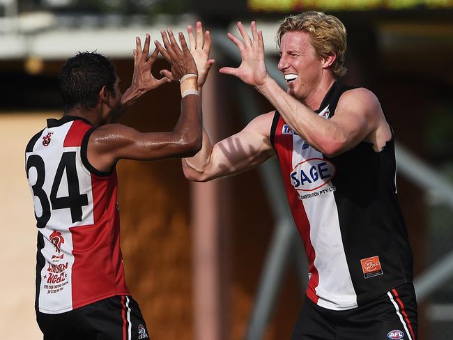 Southern Districts Charles McAdam celebrates with Ed Barlow after he makes a goal during Saturday's game against Darwin at TIO.