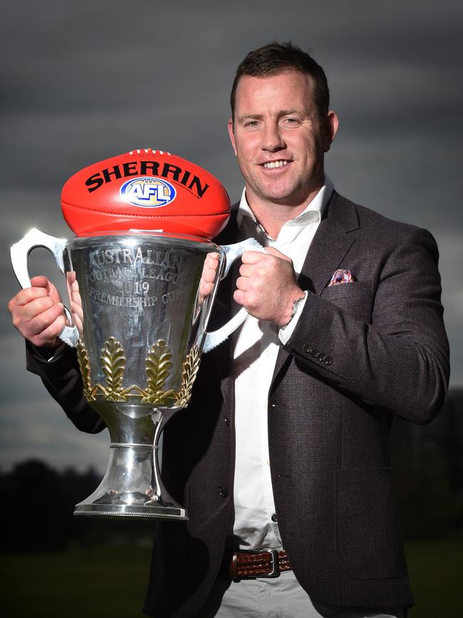 Steve Johnson with the premiership trophy. Picture: Tony Gough