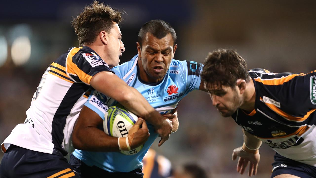 Kurtley Beale of the Waratahs is tackled at GIO Stadium.