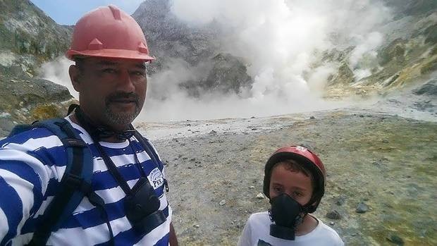 Paul Kingi on White Island with a young tourist.