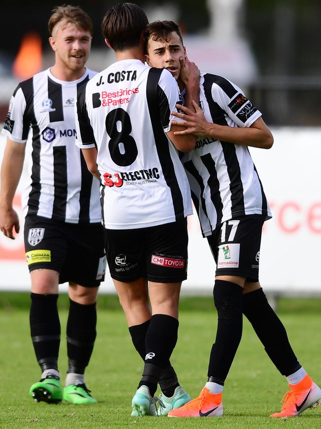 Stefan Casalbore celebrates a goal with teammates during the 10-0 drubbing of Elizabeth Vale at Oakden on Saturday. Picture: AAP/Mark Brake