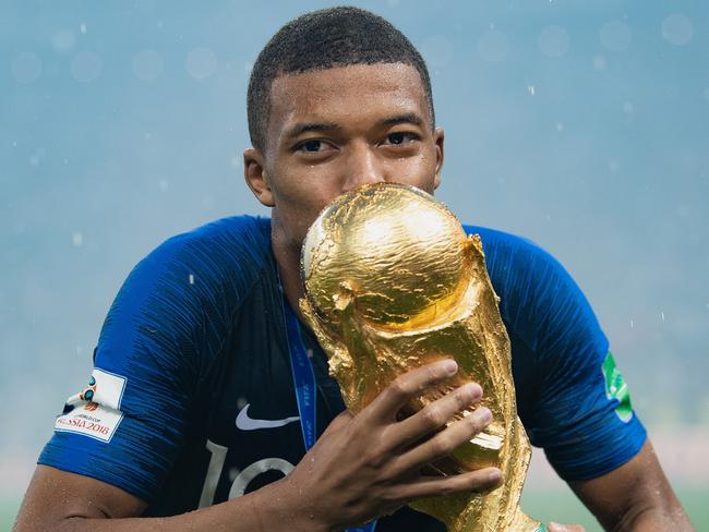 Kylian Mbappe celebrates with the World Cup Trophy after France’s 2018 win. Picture: Getty Images