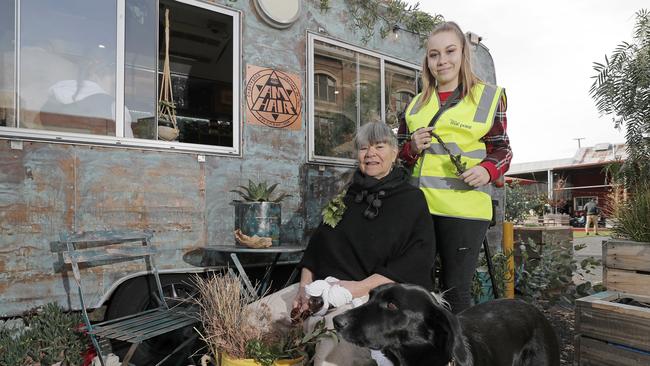 Aboriginal horticulturalist Kris Schaffer and Kitana Mansell take a moment to enjoy the healing garden at Macquarie Point. Picture: PATRICK GEE