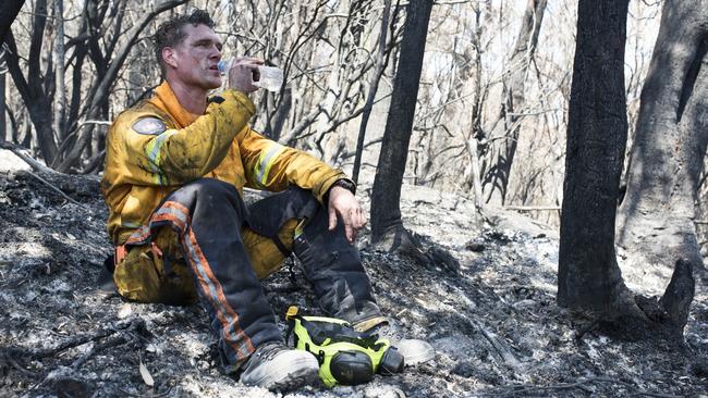 Tasmania Fire Service firefighter Simon Pilkington at the Gell River fire. Picture: WARREN FREY/TASMANIA FIRE SERVICE