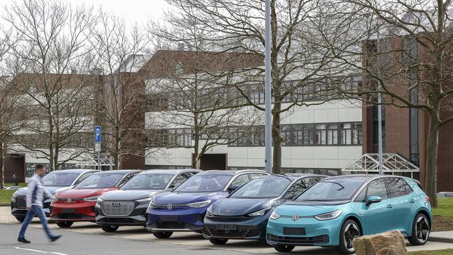 An employee walks along the range of e-vehicles produced at Volkswagen's Zwickau plant. Cars including the Audi Q4 e-tron Sportback and Volkswagen’s ID range have been prioritised for markets with more stringent fuel standards. Photo: Jan Woitas/dpa (Photo by Jan Woitas/Getty Images)